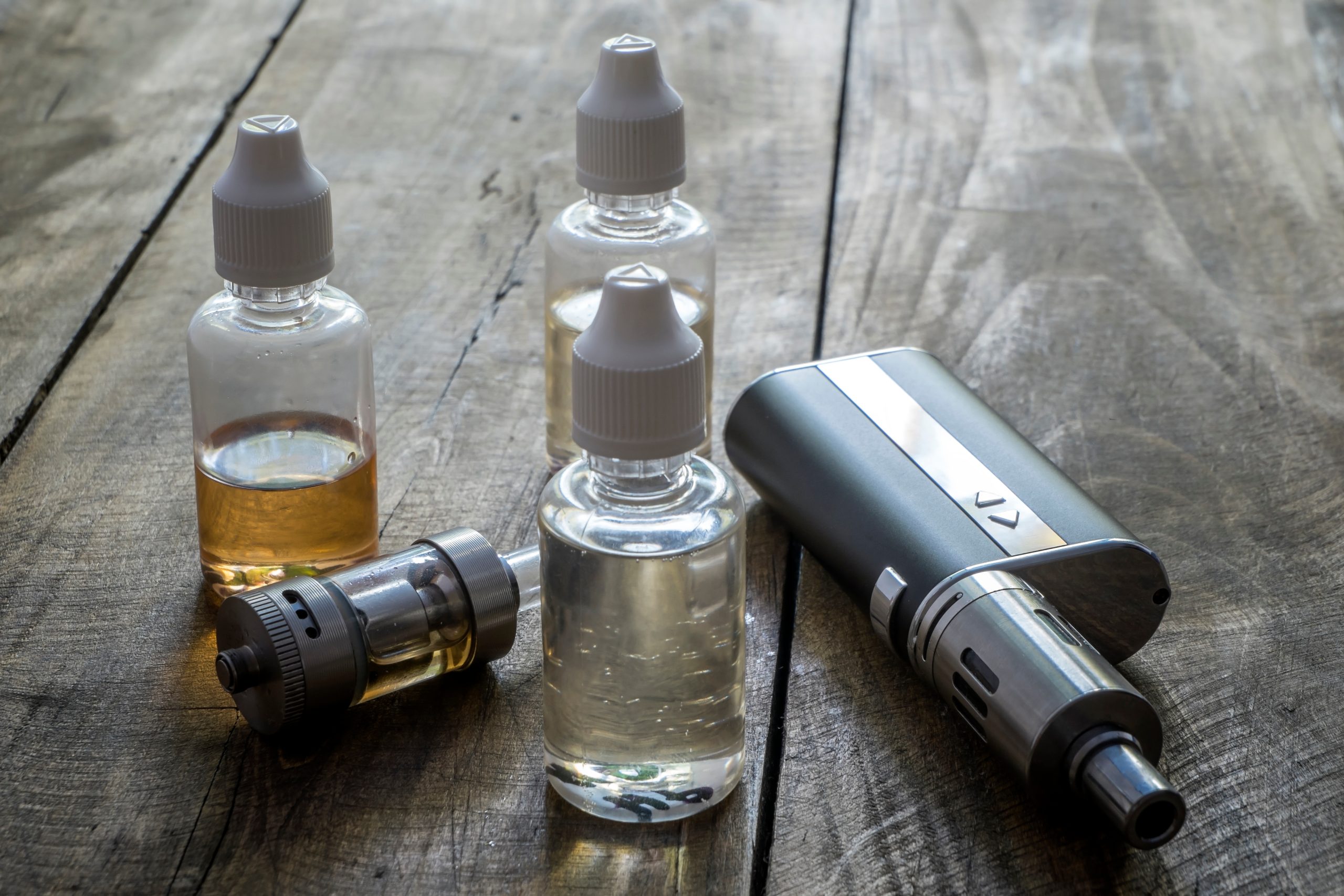 e-cigarettes with different re-fill bottles, close up
